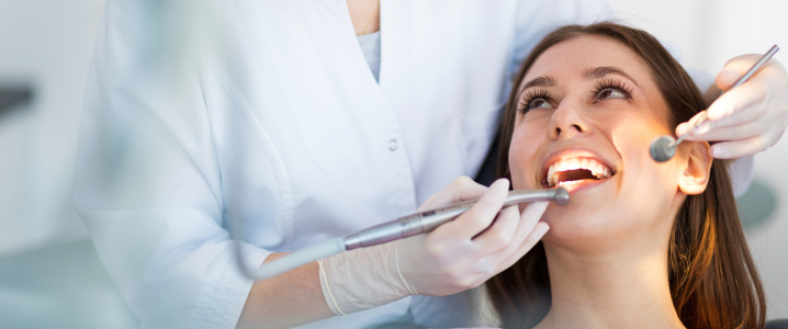 woman in dentists chair receiving dental treatment