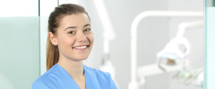 female dentist smiling in dentist's office